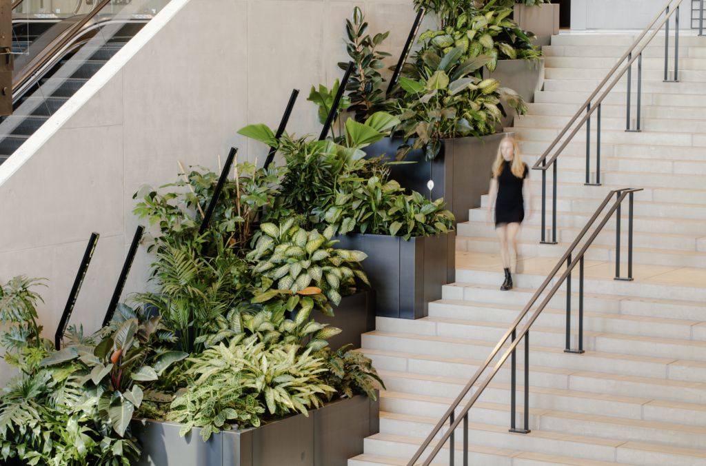 Biophilic staircase with integrated indoor planting at Booking.com office Amsterdam by MOSS