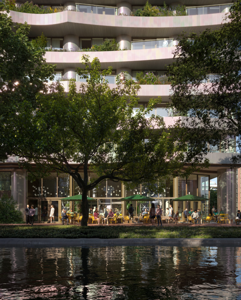 Residential building façade with green terraces at CECI Amsterdam behind urban trees