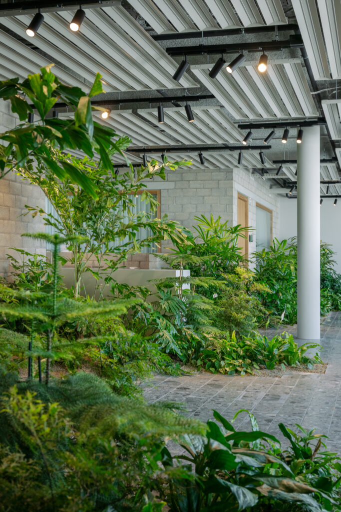 Biophilic office interior at Holcim Switzerland with large-scale planting integrated into architecture