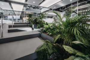 Biophilic staircase with integrated tropical planting at The Garage Amsterdam by MOSS