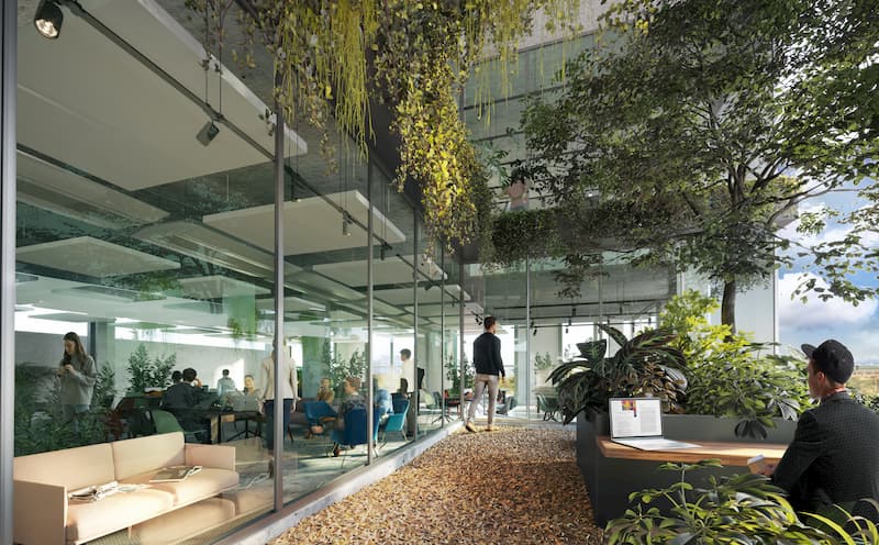 Biophilic office interior with indoor plants, natural materials, and workspace integration for employee well-being