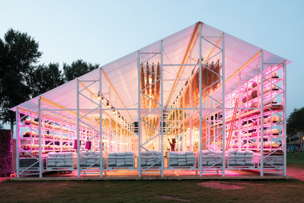 MOSS-designed greenhouse for Lowlands festival with integrated greenery and sustainable materials