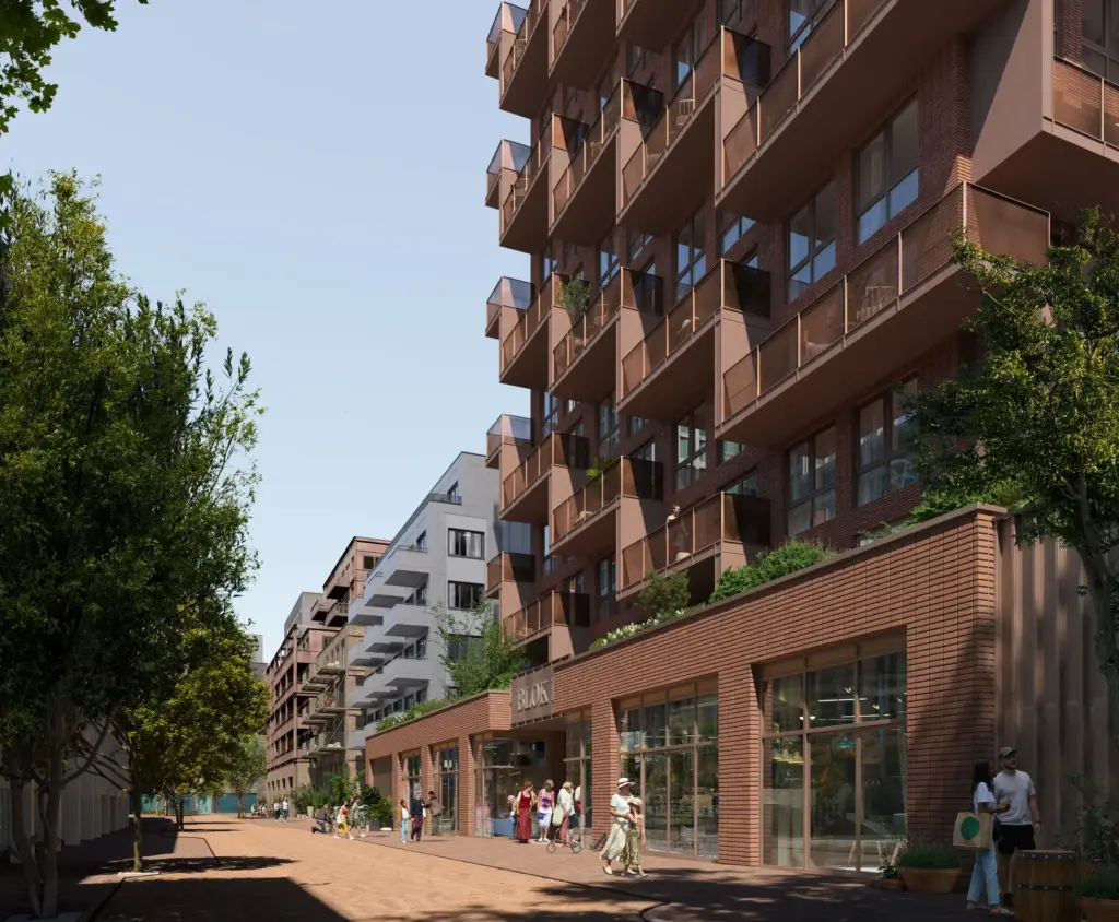 Street-level view of NDSM Embark with planted balconies and landscaping in Amsterdam Noord